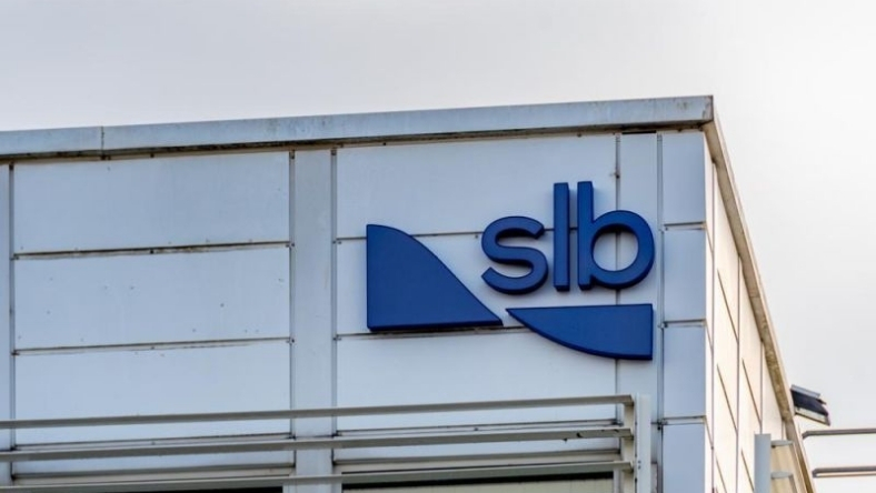 SLB logo displayed on exterior wall of office building