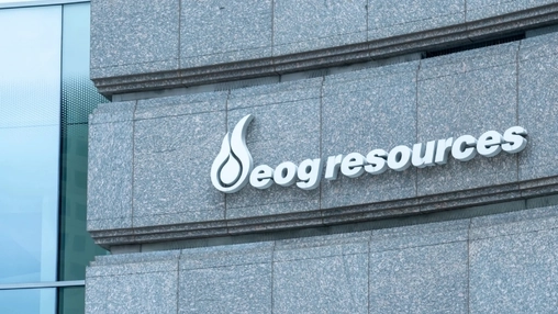 EOG Resources corporate building exterior with white logo and flame symbol mounted on granite cladding