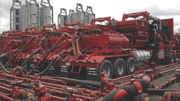 Hydraulic fracturing pumps and piping at oilfield well site